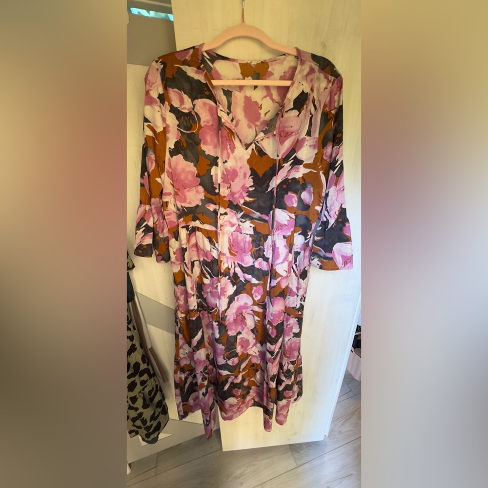 Modest, breathable, Mu-Mu style dress with flowy sleeves.